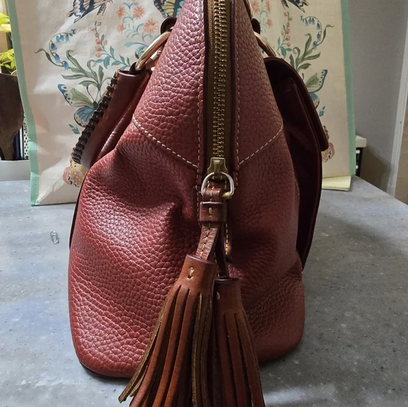 Beautiful red leather Dooney & Bourke purse with crossbody option